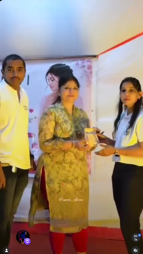 Anvi Silver team giving a gift to a customer at an event