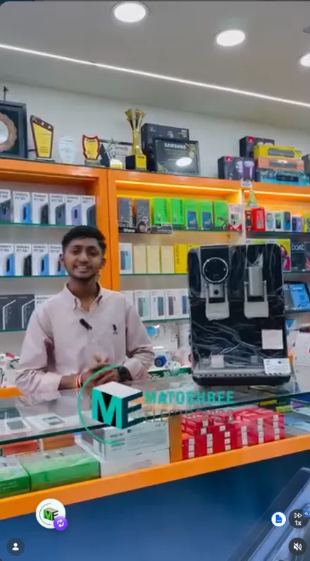 Matoshree Electronics staff member explaining products inside the Pathardi Phata store
